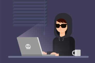 Is Bitcoin Really Anonymous?: A Detailed Look Anonymous bitcoin user using a laptop